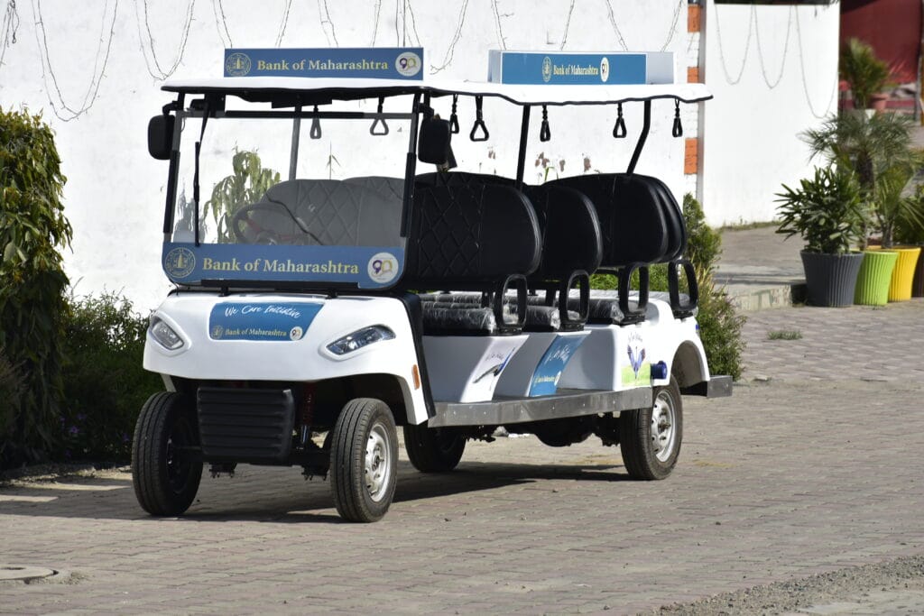 a 8 seater golf cart on the road, photo taken from the front zoomed in